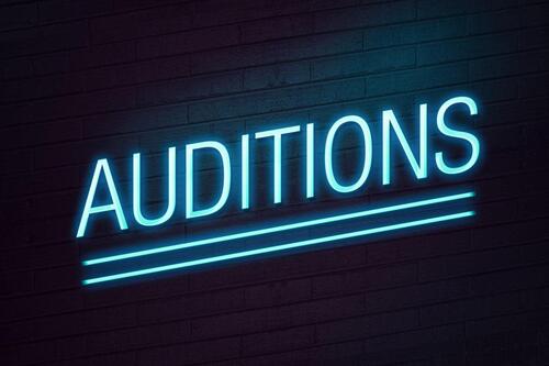 The word audition in neon blue.